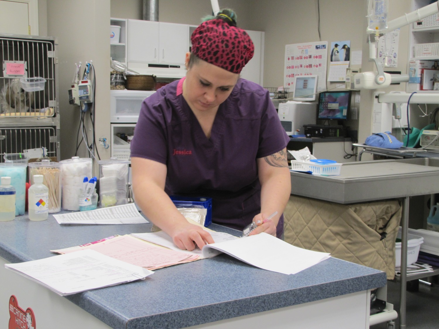 Tech Jessica updates a patient's records after a procedure